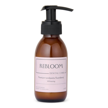 Bruin flesje met pomp en roze etiket 'rebloom care premium tandpasta fluoridevrij'